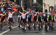 14 August 2022; Sam Bennett of Ireland crosses the line in fifth place as Fabio Jakobsen of Netherlands celebrates winning during the 28th UEC Road Cycling European Championships during day 4 of the European Championships 2022 in Munich, Germany. Photo by David Fitzgerald/Sportsfile