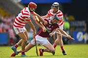 14 August 2022; Patrick O'Connor of St Martin's is tackled by Paul Morris, left, and Corey Byrne Dunbar of Ferns St Aidan's during the Wexford County Senior Hurling Championship Final match between St Martin's and Ferns St Aidan's at Chadwicks Wexford Park in Wexford. Photo by Ramsey Cardy/Sportsfile