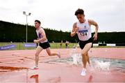 14 August 2022; Finlay Daly of Sligo AC, on his way to winning the division one men's 3000m steeplechase, right, alongside Paul O'Donnell of Dundrum South Dublin AC, on his way to winning the premier men's 3000m steeplchase during the AAI National Outdoor League Final at Tullamore, Offaly. Photo by Sam Barnes/Sportsfile