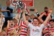 14 August 2022; Declan Byrne, left, and Gavin Bailey of Ferns St Aidan's lift the trophy after the Wexford County Senior Hurling Championship Final match between St Martin's and Ferns St Aidan's at Chadwicks Wexford Park in Wexford. Photo by Ramsey Cardy/Sportsfile