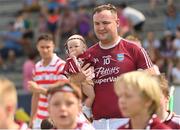 14 August 2022; Joe Coleman of St Martin's parades with 6 month old daughter Darcie before the Wexford County Senior Hurling Championship Final match between St Martin's and Ferns St Aidan's at Chadwicks Wexford Park in Wexford. Photo by Ramsey Cardy/Sportsfile