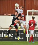 14 August 2022; St Patrick's Athletic goalkeeper Danny Rogers claims a cross, under pressure from Nando Pijnaker of Sligo Rovers, left, during the SSE Airtricity League Premier Division match between St Patrick's Athletic and Sligo Rovers at Richmond Park in Dublin. Photo by Seb Daly/Sportsfile