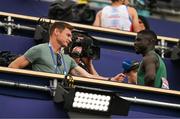 15 August 2022; Israel Olatunde of Ireland, right, is interviewed by RTÉ's David Gillick after winning his Men's 100m heat during day 5 of the European Championships 2022 at the Olympiastadion in Munich, Germany. Photo by Ben McShane/Sportsfile