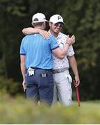 14 August 2022; Connor Syme of Scotland, left, and Ewen Ferguson of Scotland wish each other good luck on the putting green during the ISPS HANDA World Invitational at Galgorm Castle and Massereene Golf Clubs in Ballymena, Antrim. Photo by John Dickson/Sportsfile