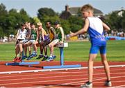 13 August 2022; Athletes watch on during the u12 4x100m boys relay at the Aldi Community Games National Track and Field Finals that attract over 2,000 children to SETU Carlow Sports Campus in Carlow. Photo by Ramsey Cardy/Sportsfile