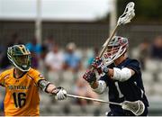 15 August 2022; Christopher Kirst of USA takes a shot at goal despite the tackle of Dan Bowater of Australia during the 2022 World Lacrosse Men's U21 World Championship - Pool A match between Australia and USA at University of Limerick. Photo by Tom Beary/Sportsfile
