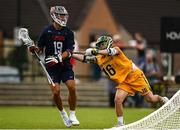 15 August 2022; Brendan Grimes of USA is tackled by Dan Bowater of Australia during the 2022 World Lacrosse Men's U21 World Championship - Pool A match between Australia and USA at University of Limerick. Photo by Tom Beary/Sportsfile