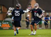 15 August 2022; Alex Slusher, left, celebrates after scoring a goal with Cole Kirst of USA during the 2022 World Lacrosse Men's U21 World Championship - Pool A match between Australia and USA at University of Limerick. Photo by Tom Beary/Sportsfile