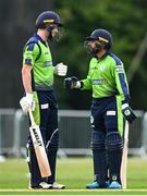 15 August 2022; George Dockrell, left, and Simi Singh of Ireland during the Men's T20 International match between Ireland and Afghanistan at Stormont in Belfast. Photo by Ramsey Cardy/Sportsfile