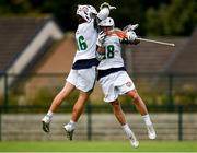 16 August 2022; Conor Foley of Ireland, right, celebrates with teammate Aidan Dempsey after scoring their side's first goal during the 2022 World Lacrosse Men's U21 World Championship - Play-in match between Ireland and Czech Republic at the University of Limerick in Limerick. Photo by Tom Beary/Sportsfile