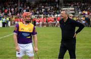 16 August 2022; Ollie Canning of Jim Bolger's Stars with referee Jimmy Barry Murphy during the Hurling for Cancer Research 2022 match at St Conleth's Park in Newbridge, Kildare. Photo by Stephen McCarthy/Sportsfile