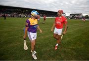 16 August 2022; Stephen Hunt of Jim Bolger's Stars and Lee Chin of Davy Russell's Best, right, during the Hurling for Cancer Research 2022 match at St Conleth's Park in Newbridge, Kildare. Photo by Stephen McCarthy/Sportsfile