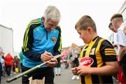 16 August 2022; Liam Griffin, manager of Jim Bolger's Stars, signs an autograph before the Hurling for Cancer Research 2022 match at St Conleth's Park in Newbridge, Kildare. Photo by Stephen McCarthy/Sportsfile