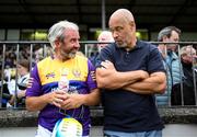 16 August 2022; Stephen Hunt of Jim Bolger's Stars takes a break alongside former Republic of Ireland international Paul McGrath during the Hurling for Cancer Research 2022 match at St Conleth's Park in Newbridge, Kildare. Photo by Stephen McCarthy/Sportsfile