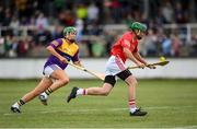 16 August 2022; Jamie Codd of Davy Russell's Best in action against Miriam Walsh of Jim Bolger's Stars during the Hurling for Cancer Research 2022 match at St Conleth's Park in Newbridge, Kildare. Photo by Stephen McCarthy/Sportsfile