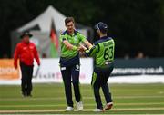 17 August 2022; Mark Adair of Ireland, left, celebrates with teammate Andrew Balbirnie after taking the wicket of Hazratuillah Zazai of Afghanistan during the Men's T20 International match between Ireland and Afghanistan at Stormont in Belfast. Photo by Harry Murphy/Sportsfile