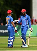17 August 2022; Usman Ghani of Afghanistan, right, and teammate Najibullah Zadran fist bump during the Men's T20 International match between Ireland and Afghanistan at Stormont in Belfast. Photo by Harry Murphy/Sportsfile