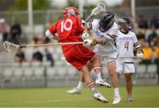 17 August 2022; Ed Loveland of England is tackled by Douglas Powless of Haudenosaunee during the 2022 World Lacrosse Men's U21 World Championship quarter final match between England and Haudenosaunee at the University of Limerick in Limerick. Photo by Tom Beary/Sportsfile