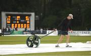 17 August 2022; A memeber of the groundstaff inspects the pitch during the Men's T20 International match between Ireland and Afghanistan at Stormont in Belfast. Photo by Harry Murphy/Sportsfile