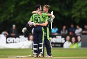 17 August 2022; George Dockrell and Harry Tector of Ireland embrace after their side's victory in the Men's T20 International match between Ireland and Afghanistan at Stormont in Belfast. Photo by Harry Murphy/Sportsfile