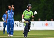 17 August 2022; George Dockrell of Ireland celebrates after hitting the winning run in the Men's T20 International match between Ireland and Afghanistan at Stormont in Belfast. Photo by Harry Murphy/Sportsfile