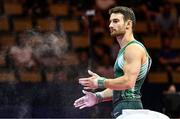 18 August 2022; Daniel Fox of Ireland powders his hands before competing in the Men's Pommel Horse during day 8 of the European Championships 2022 at the Olympiahalle in Munich, Germany. Photo by Ben McShane/Sportsfile