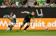 18 August 2022; Andy Lyons of Shamrock Rovers in action against Henry Wingo of Ferencváros during the UEFA Europa League play-off first leg between Ferencváros and Shamrock Rovers at Groupama Aréna in Budapest, Hungary. Photo by Alex Nicodim/Sportsfile