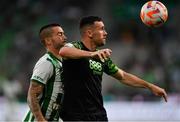 18 August 2022; Aaron Greene of Shamrock Rovers in action against Endre Botka of Ferencváros during the UEFA Europa League play-off first leg between Ferencváros and Shamrock Rovers at Groupama Aréna in Budapest, Hungary. Photo by Alex Nicodim/Sportsfile