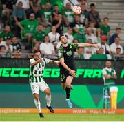 18 August 2022; Neil Farrugia of Shamrock Rovers in action against Endre Botka of Ferencváros during the UEFA Europa League play-off first leg between Ferencváros and Shamrock Rovers at Groupama Aréna in Budapest, Hungary. Photo by Alex Nicodim/Sportsfile