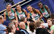 19 August 2022; The Ireland Women's 4x400m Relay team, from left, Sophie Becker, Phil Healy, Sharlene Mawdsley and Rhasidat Adeleke meet supporters after finishing second to qualify for the Women's 4x400m Relay Final during day 9 of the European Championships 2022 at the Olympiastadion in Munich, Germany. Photo by Ben McShane/Sportsfile