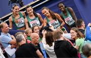 19 August 2022; The Ireland Women's 4x400m Relay team, from left, Sophie Becker, Phil Healy, Sharlene Mawdsley and Rhasidat Adeleke meet supporters after finishing second to qualify for the Women's 4x400m Relay Final during day 9 of the European Championships 2022 at the Olympiastadion in Munich, Germany. Photo by Ben McShane/Sportsfile