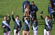 19 August 2022; Ireland Chef d'equipe Michael Blake lifts the Aga Khan trophy alongside riders, from left, Cian O'Connor, Shane Sweetnam, Conor Swail and Max Wachman after their victory in the Longines FEI Jumping Nations Cup™ of Ireland during the Longines FEI Dublin Horse Show at the RDS in Dublin. Photo by Piaras Ó Mídheach/Sportsfile