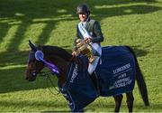 19 August 2022; Conor Swail of Ireland aboard Count Me In celebrates with the Aga Khan trophy after his side's victory in the Longines FEI Jumping Nations Cup™ of Ireland during the Longines FEI Dublin Horse Show at the RDS in Dublin. Photo by Piaras Ó Mídheach/Sportsfile