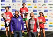 20 August 2022; Irish Life Chief Executive Declan Bolger, front left, with Civil Service Harriers Chairperson Owen McFeely, front right, with Women's race top three, Kate Purcell of Raheny Shamrock AC, Dublin, centre, first, Caitlyn Harvey of Annadale Striders, left, second, and Niamh Clifford of Donore Harriers AC, Dublin, third, during the Irish Life Dublin Race Series Frank Duffy 10 Mile in Phoenix Park in Dublin. Photo by Sam Barnes/Sportsfile