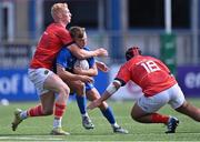 20 August 2022; Jack Murphy of Leinster in action against Munster players Sean Condon, left, and Rory Doody during the U19 Interprovincial Series match between Leinster and Munster at Energia Park in Dublin. Photo by Piaras Ó Mídheach/Sportsfile
