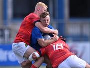 20 August 2022; Jack Murphy of Leinster in action against Munster players Sean Condon, left, and Rory Doody during the U19 Interprovincial Series match between Leinster and Munster at Energia Park in Dublin. Photo by Piaras Ó Mídheach/Sportsfile