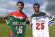 20 August 2022; Colin Baez of Puerto Rico and Aidan Dempsey of Ireland following the 2022 World Lacrosse Men's U21 World Championship 7th place match between Ireland and Puerto Rico at the University of Limerick in Limerick. Photo by Tom Beary/Sportsfile
