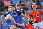 20 August 2022; Evan Moynihan of Leinster is tackled by Oisín Minogue of Munster during the U18 Schools Interprovincial Series match between Leinster and Munster at Energia Park in Dublin. Photo by Piaras Ó Mídheach/Sportsfile