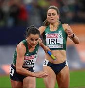 20 August 2022; Phil Healy receives the baton from Sophie Becker of Ireland during the Women's 4x400m Relay Final during day 10 of the European Championships 2022 at the Olympiastadion in Munich, Germany. Photo by Ben McShane/Sportsfile