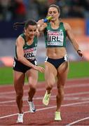 20 August 2022; Phil Healy receives the baton from Sophie Becker of Ireland during the Women's 4x400m Relay Final during day 10 of the European Championships 2022 at the Olympiastadion in Munich, Germany. Photo by Ben McShane/Sportsfile