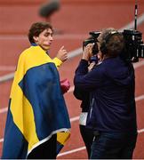 20 August 2022; Armand Duplantis of Sweden eats a street waffle after winning the Men's Pole Vault Final during day 10 of the European Championships 2022 at the Olympiastadion in Munich, Germany. Photo by David Fitzgerald/Sportsfile