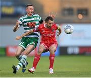21 August 2022; Robbie Benson of Dundalk in action against Ronan Finn of Shamrock Rovers during the SSE Airtricity League Premier Division match between Shamrock Rovers and Dundalk at Tallaght Stadium in Dublin. Photo by Stephen McCarthy/Sportsfile