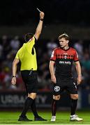 12 August 2022; Conor Levingston of Bohemians is shown a yellow card by referee Adriano Reale during the SSE Airtricity League Premier Division match between Bohemians and Dundalk at Dalymount Park in Dublin. Photo by Sam Barnes/Sportsfile