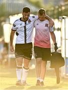 12 August 2022; Patrick Hoban of Dundalk leaves the field with the help of Dundalk chartered physiotherapist Danny Miller after picking up an injury during the SSE Airtricity League Premier Division match between Bohemians and Dundalk at Dalymount Park in Dublin. Photo by Sam Barnes/Sportsfile