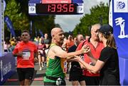 20 August 2022; Runners celebrate finishing the Irish Life Dublin Race Series Frank Duffy 10 Mile in Phoenix Park in Dublin. Photo by Sam Barnes/Sportsfile