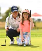 23 August 2022; Irish LPGA star, and The K Club’s touring professional, Leona Maguire during a golf clinic with 32 very lucky children, invited from Straffan primary school, Scoil Bhríde, and the local Straffan area. Pictured is Leona Maguire with Lucy Gaffey, age 6, at The K Club in Straffan, Kildare. Photo by Ramsey Cardy/Sportsfile