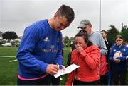 25 August 2022; Leinster supporter Amanda Butler reacts as Jonathan Sexton signs a autograph during an open training session on day one of the Leinster Rugby 12 Counties Tour at Longford RFC in Longford. Photo by Harry Murphy/Sportsfile