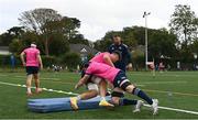 25 August 2022; Brian Deeny is tackled by Ryan Baird watched by contact skills coach Sean O'Brien during an open training session on day one of the Leinster Rugby 12 Counties Tour at Longford RFC in Longford. Photo by Harry Murphy/Sportsfile