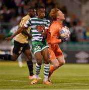 25 August 2022; Aidomo Emakhu of Shamrock Rovers collides with Ferencváros goalkeeper Ádám Bogdán during the UEFA Europa League Play-Off Second Leg match between Shamrock Rovers and Ferencvaros at Tallaght Stadium in Dublin. Photo by Seb Daly/Sportsfile
