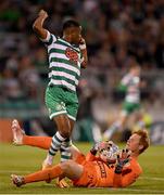 25 August 2022; Aidomo Emakhu of Shamrock Rovers tussles with Ferencváros goalkeeper Ádám Bogdán during the UEFA Europa League Play-Off Second Leg match between Shamrock Rovers and Ferencvaros at Tallaght Stadium in Dublin. Photo by Seb Daly/Sportsfile